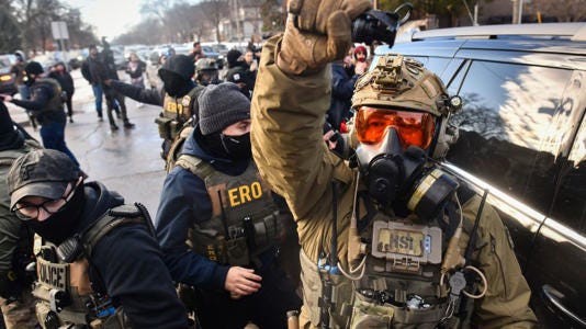 ICE and other federal agents respond to protestors in Minneapolis on Tuesday. - Octavio Jones/AFP/Getty Images