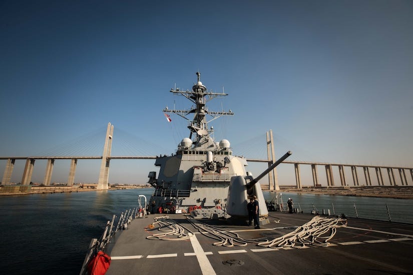 A military ship transits a body of water.