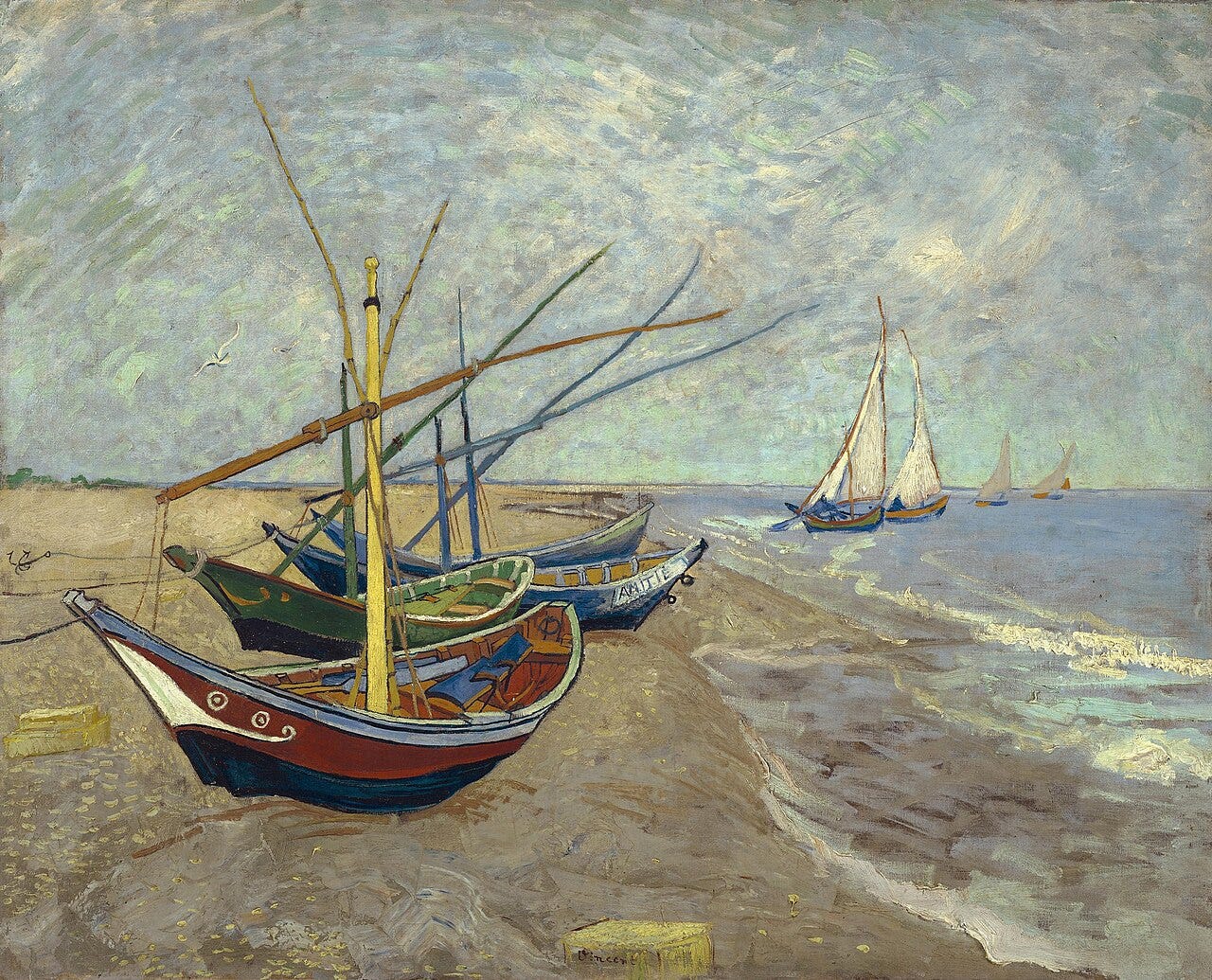Colored boats on sand