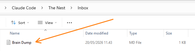 Windows File Explorer showing the path Claude Code > The Nest > Inbox. One file is listed: "Brain Dump" (MD File, 1 KB, last modified 20/05/2026 11:43). A hand-drawn arrow points to the file name. Windows File Explorer showing the path Claude Code > The Nest > Inbox. One file is listed: "Brain Dump" (MD File, 1 KB, last modified 20/05/2026 11:43). A hand-drawn arrow points to the file name.