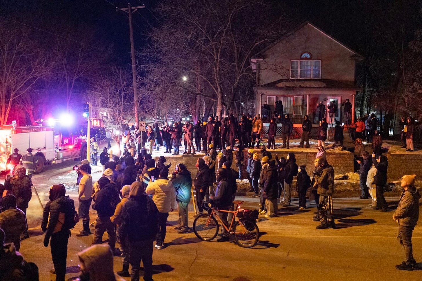 Residents confront federal agents following a shooting incident on Jan. 14, 2026 in Minneapolis, Minnesota.  (Photo by Scott Olson/Getty Images)