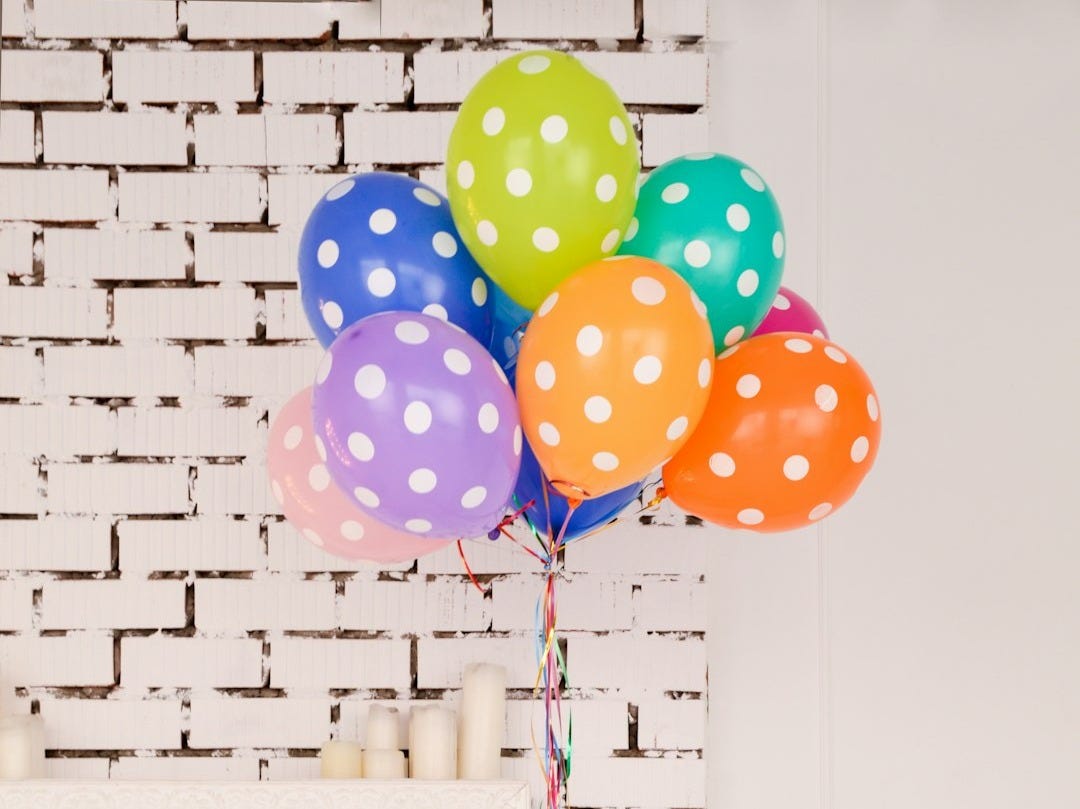 assorted-color polka dot balloons