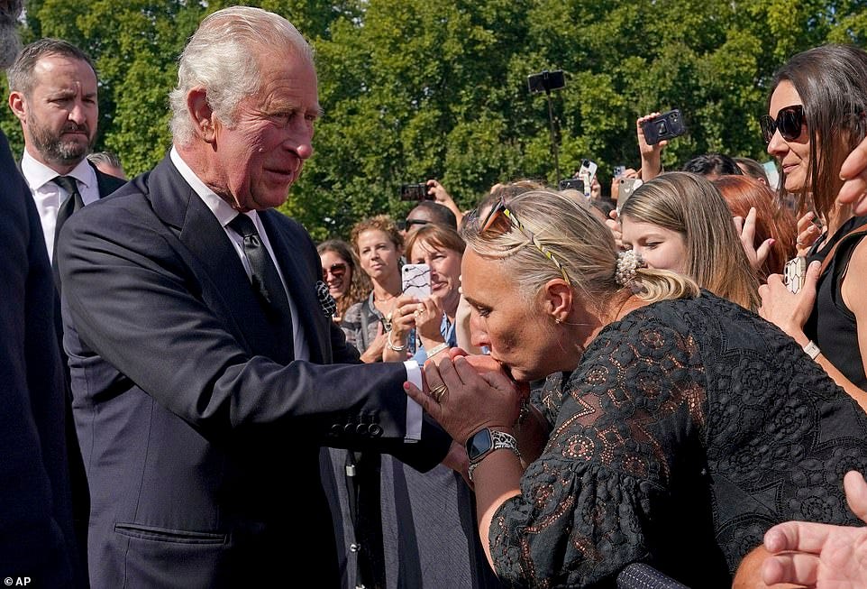 Huge crowds cheered the couple as they arrived at the palace before the King left his car. Several people kissed his hand as he passed