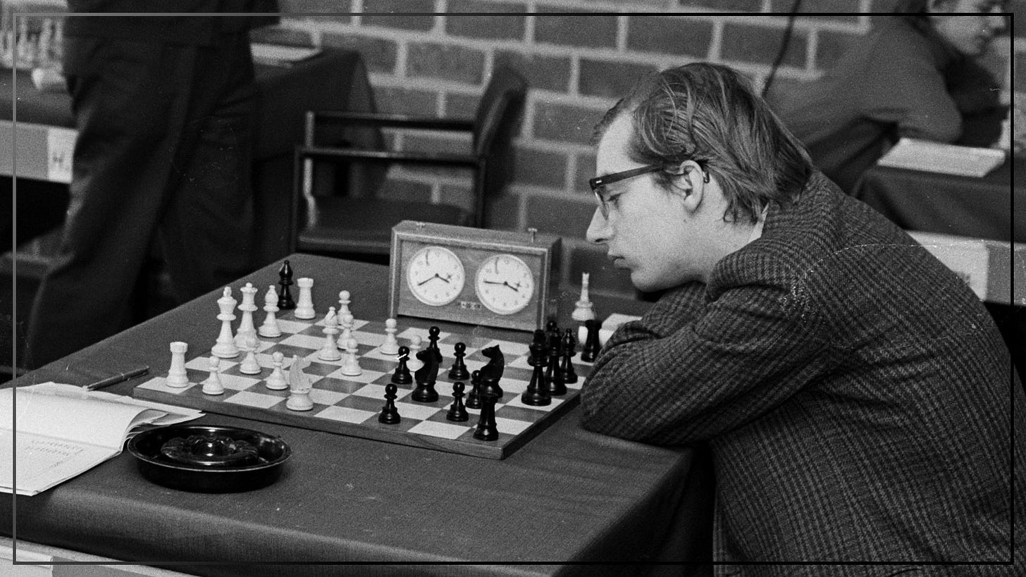 May be a black-and-white image of 3 people, chess and text