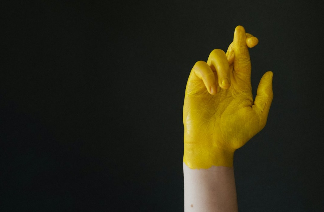 persons hand on black background