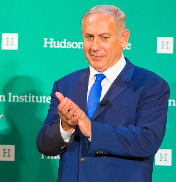(Left) Slobodan Milosevic clapping.  (Right) Benjamin Netanyahu clapping.
