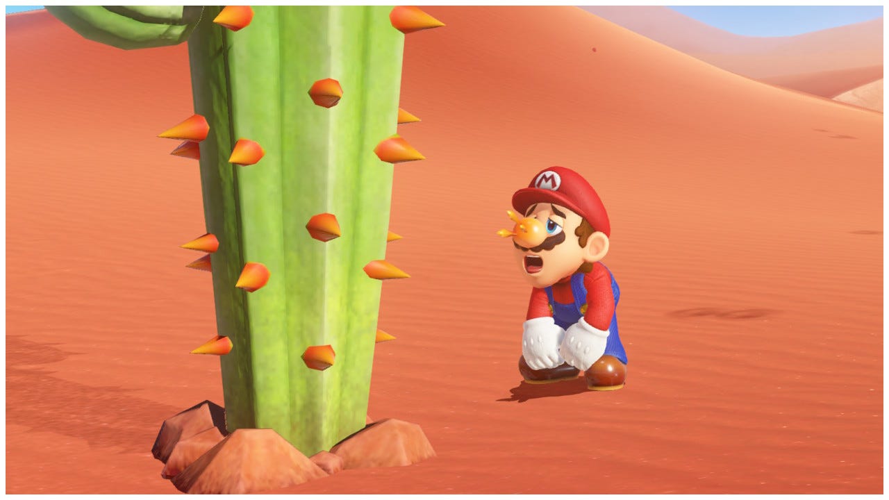 Mario pants in the hot desert. There are thorns sticking out of his nose, which is red, from the nearby cactus.