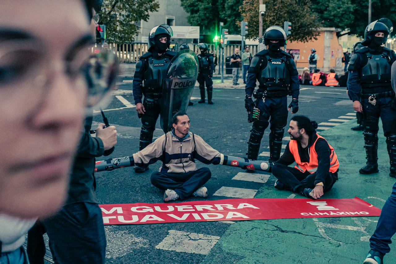 Activists occupy the square of Chile, in Lisbon, under close vigilance of police forces