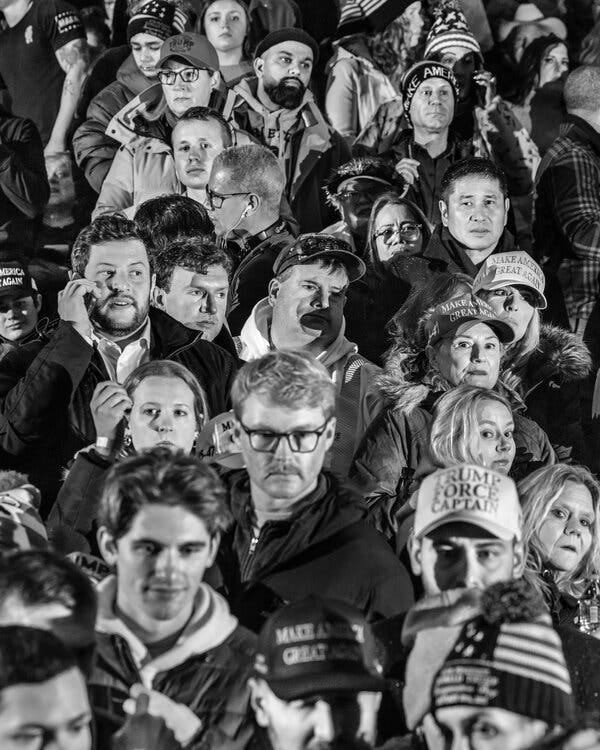 All the photographs in this article are in black-and-white. A crowd at the Make America Great Again victory rally. All the photographs in this article are in black-and-white. A crowd at the Make America Great Again victory rally.