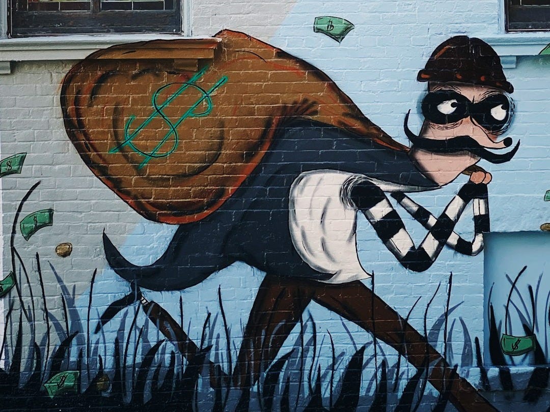 woman in black and white stripe long sleeve shirt and black sunglasses holding blue and white