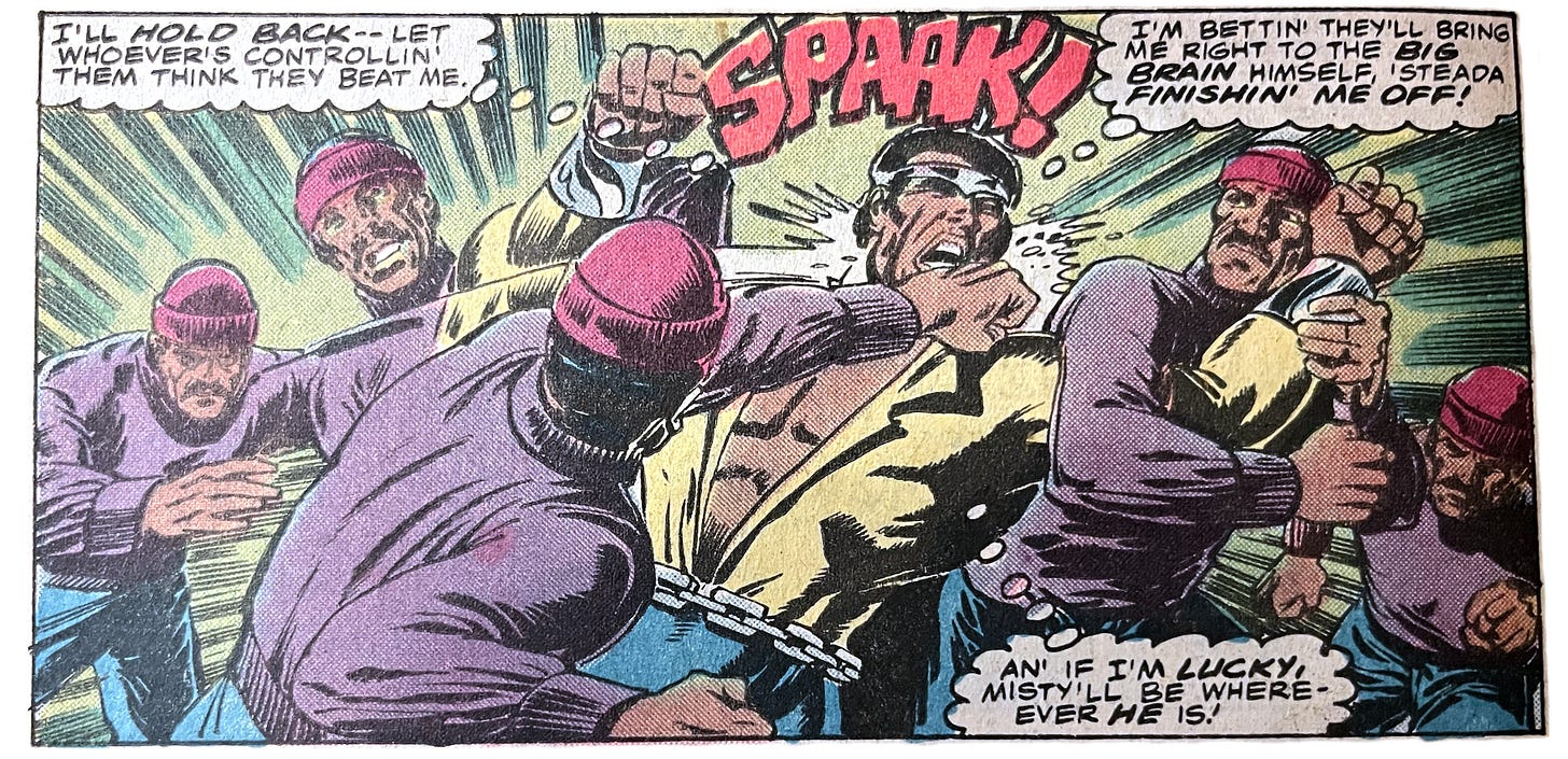 A panel from this issue showing Power Man fighting with five androids who all look like the same dude.