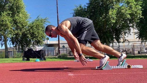 male doing sprint starts. male doing sprint starts.