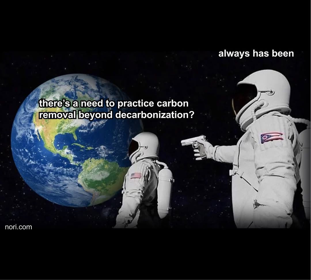 Two astronauts in space by the Earth. One asks "There's a need to practice carbon removal beyond decarbonization?" The other, behind him with a pistol: "Always has been."