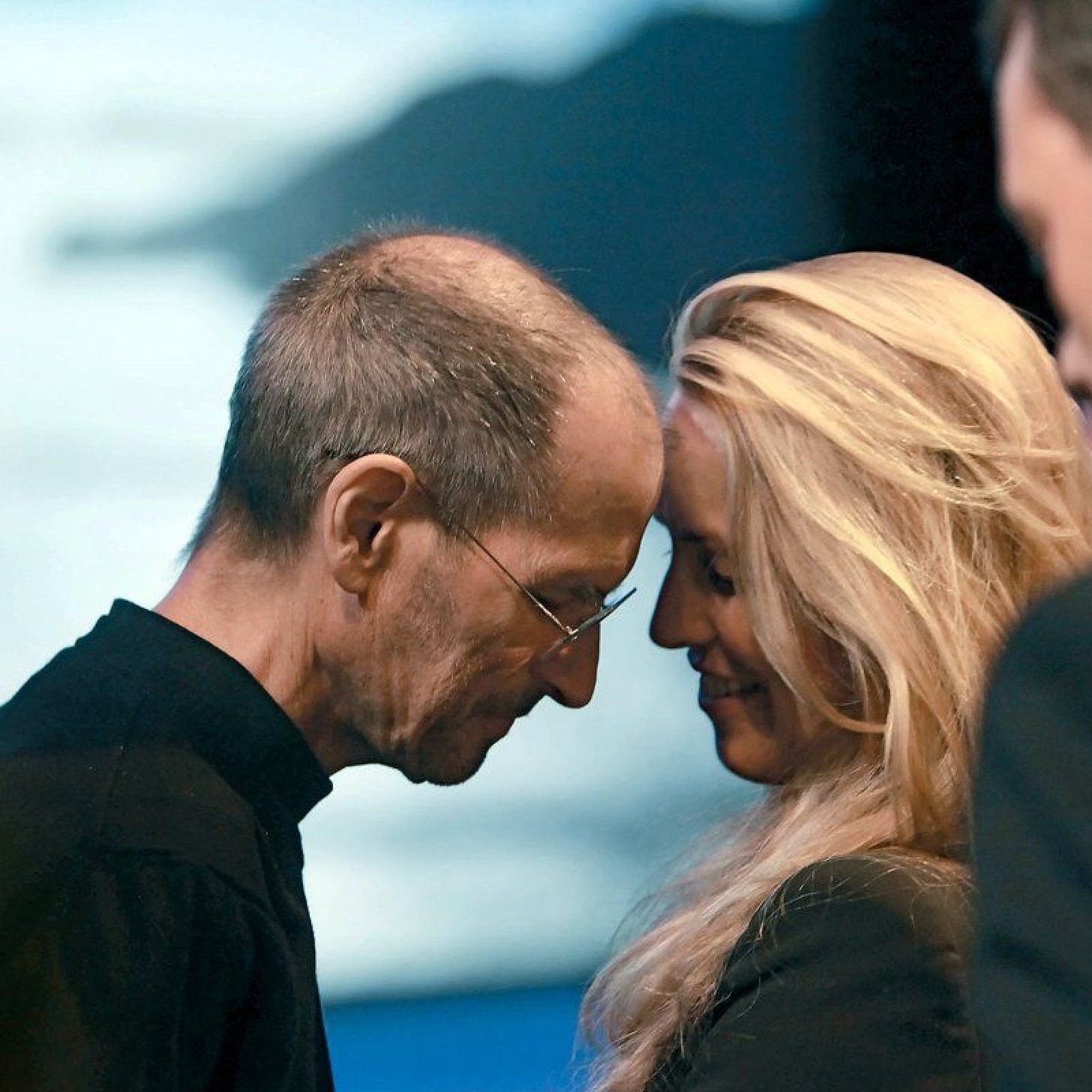 A person and person touching foreheads

Description automatically generated