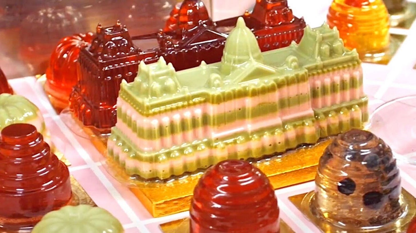 An array of multicolored, molded jellies in the shape of topiaries and the main hall of Versailles.