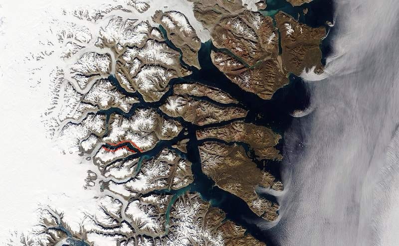 Satellite photo of King Christian X Land in eastern Greenland’s, with Dickson Fyord (a tiny tributary) outlined in red.