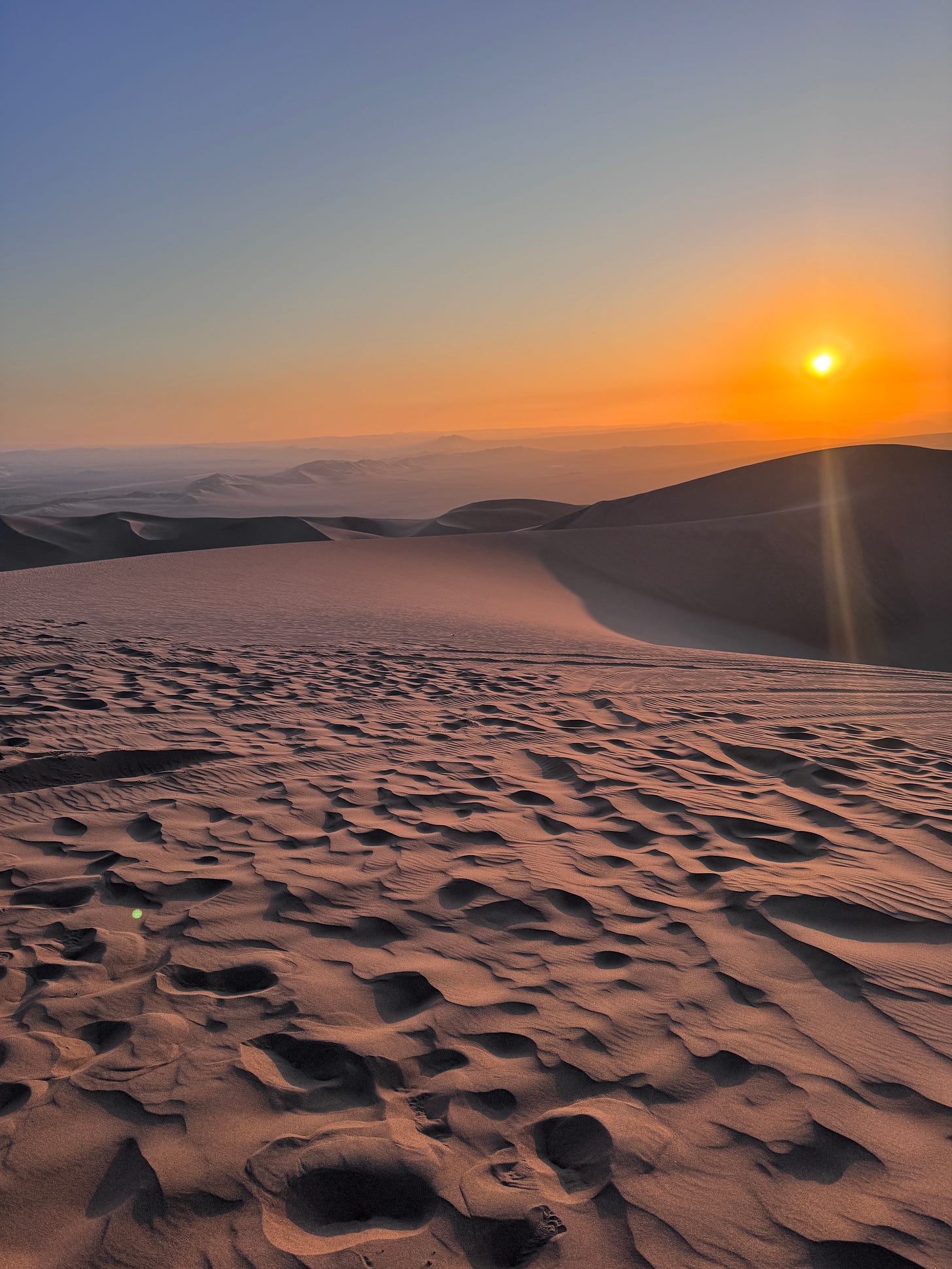 Sand dunes at sunset in Ica, Peru