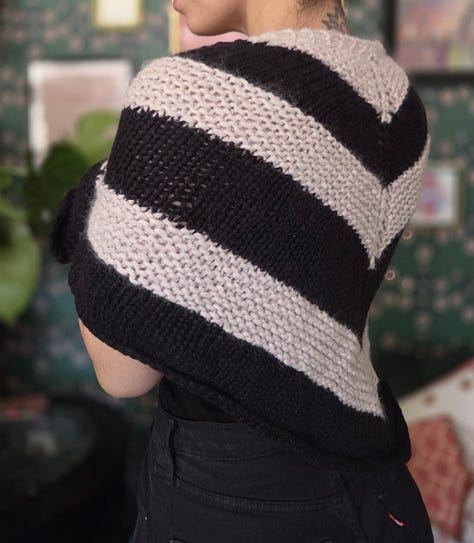 Various knitted projects including a shawl, two tank tops, a mini skirt, two sweaters, and an off the shoulder top