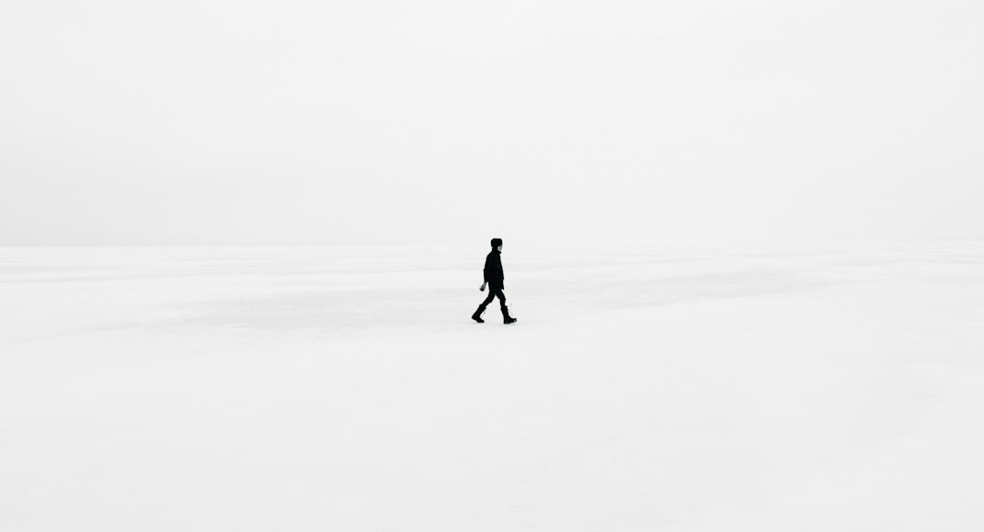 person walking on snowfield