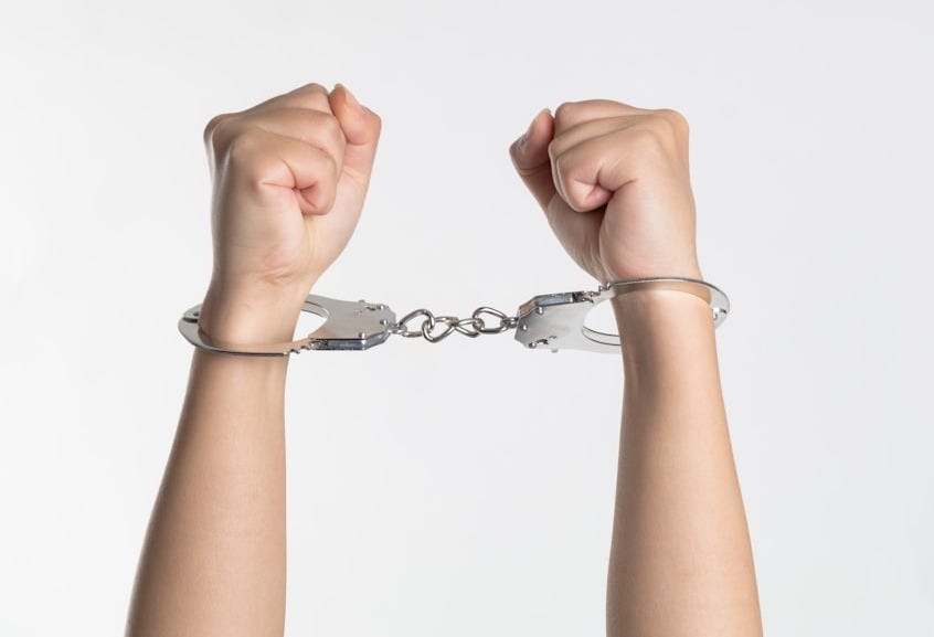 person showing handcuff person showing handcuff