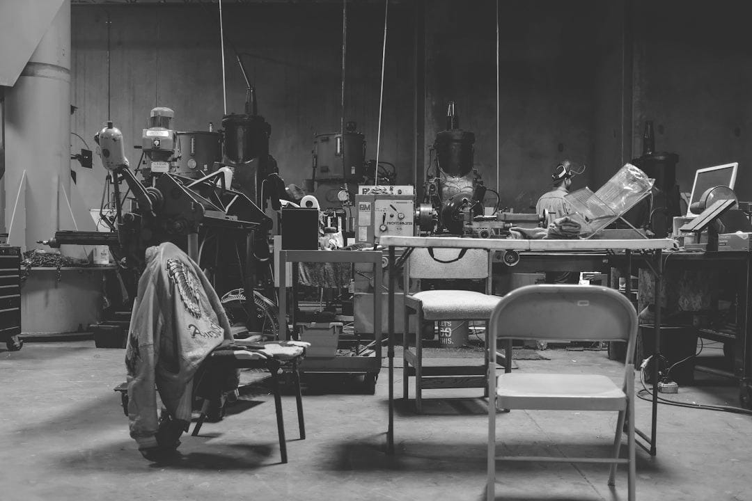 photo of industrial machines near table