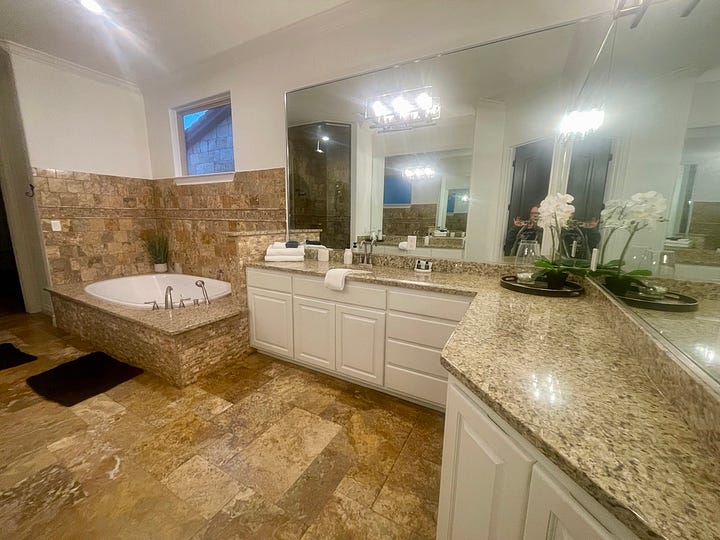 My photos of the master suite and it's amazing bathroom and the dining table that overlooks the lake.