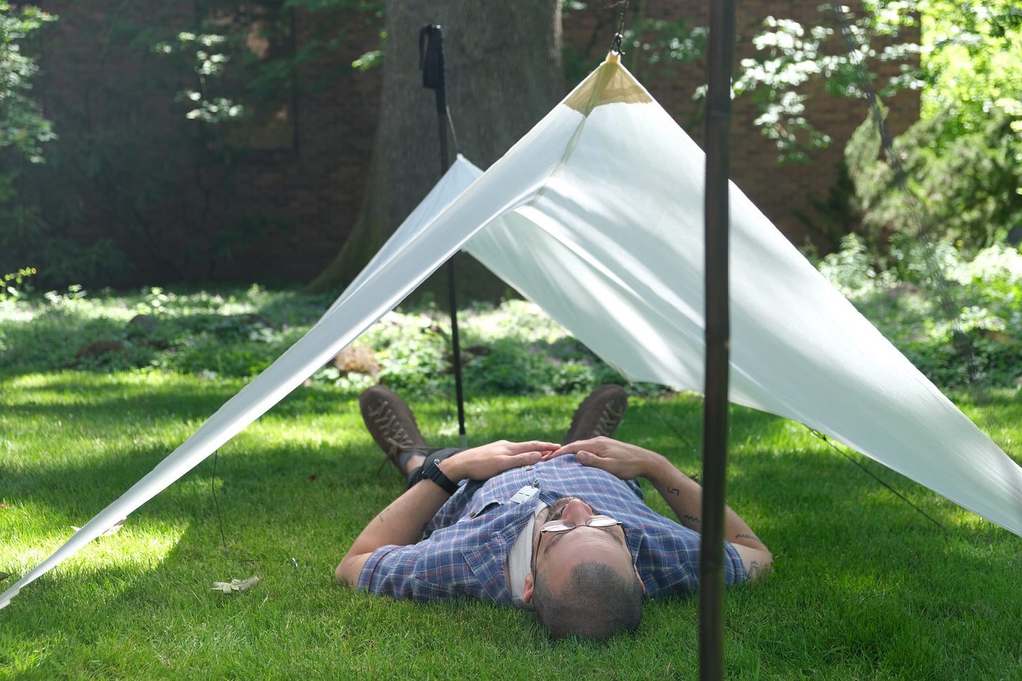Tom Bonamici under a tarp he made of silk and linseed oil