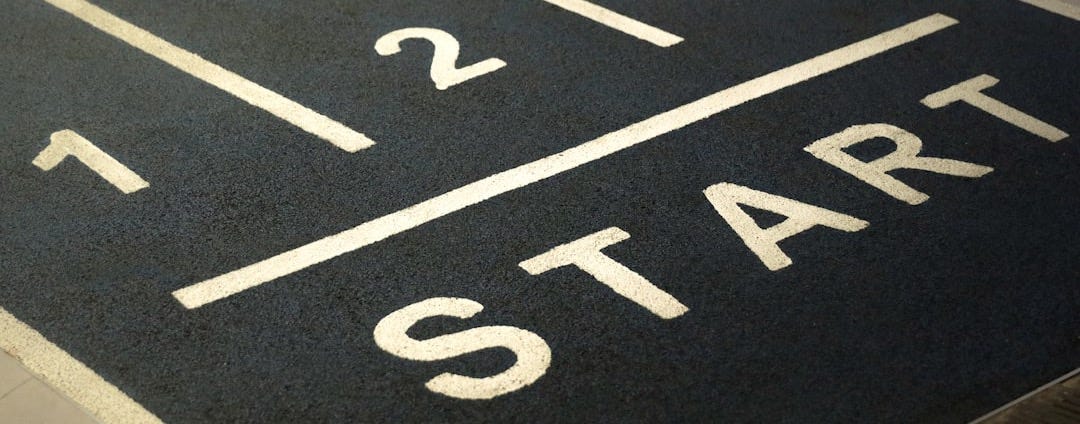 a close up of a street sign on the ground