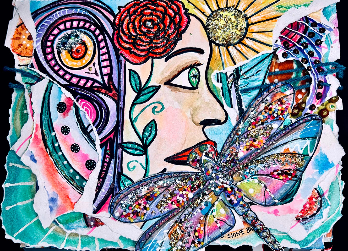 An Integrative Art Journaling collection titled Awakening the Dragonfly. A woman’s profile emerges in vibrant layers, her green eyes alive with light, framed by curling vines and a red rose in her hair. Above her, a golden sun radiates beams of glittering warmth. Across the composition, a luminous dragonfly spreads its jeweled wings, encrusted with sequins, glitter, and bursts of confetti-like color. Surrounding patterns swirl in purples, blues, and teals, echoing the energy of transformation. The piece embodies awakening, vision, and the dragonfly as a guide into luminous self-discovery.