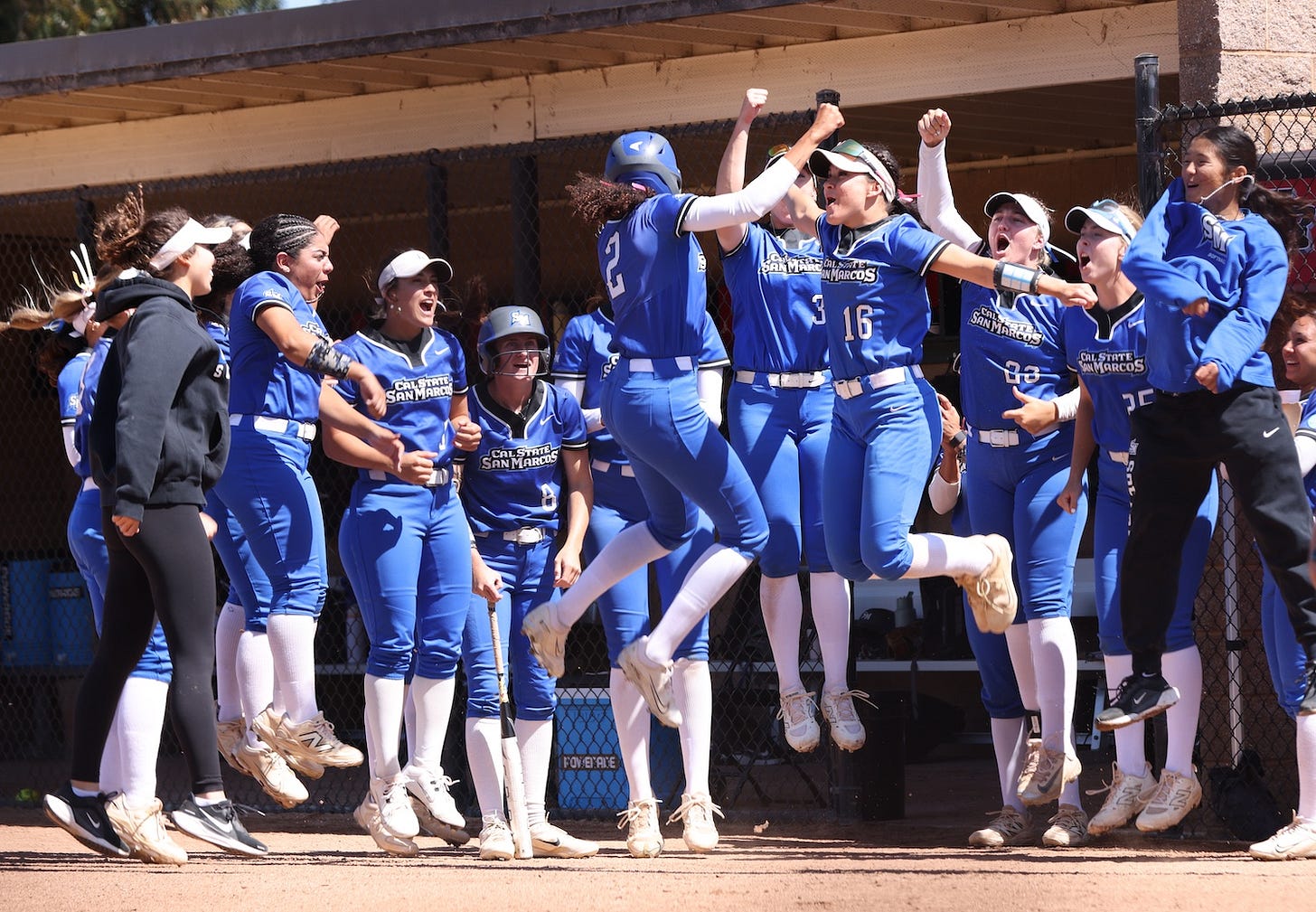 CSUSM senior Czar Fleischman (No. 2) celebrates with senior Jordan Elias (No. 16) during the CCAA Tournament last week. The top-seeded Cougars won the West Regional, advancing to Thursday’s Super Regional in San Marcos. Courtesy CSUSM Athletics