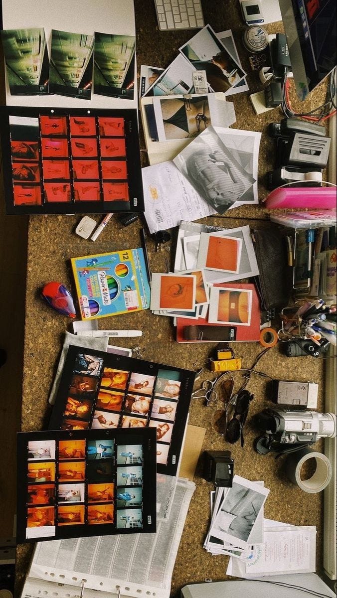 This may contain: a table topped with lots of different types of pictures and papers on top of it