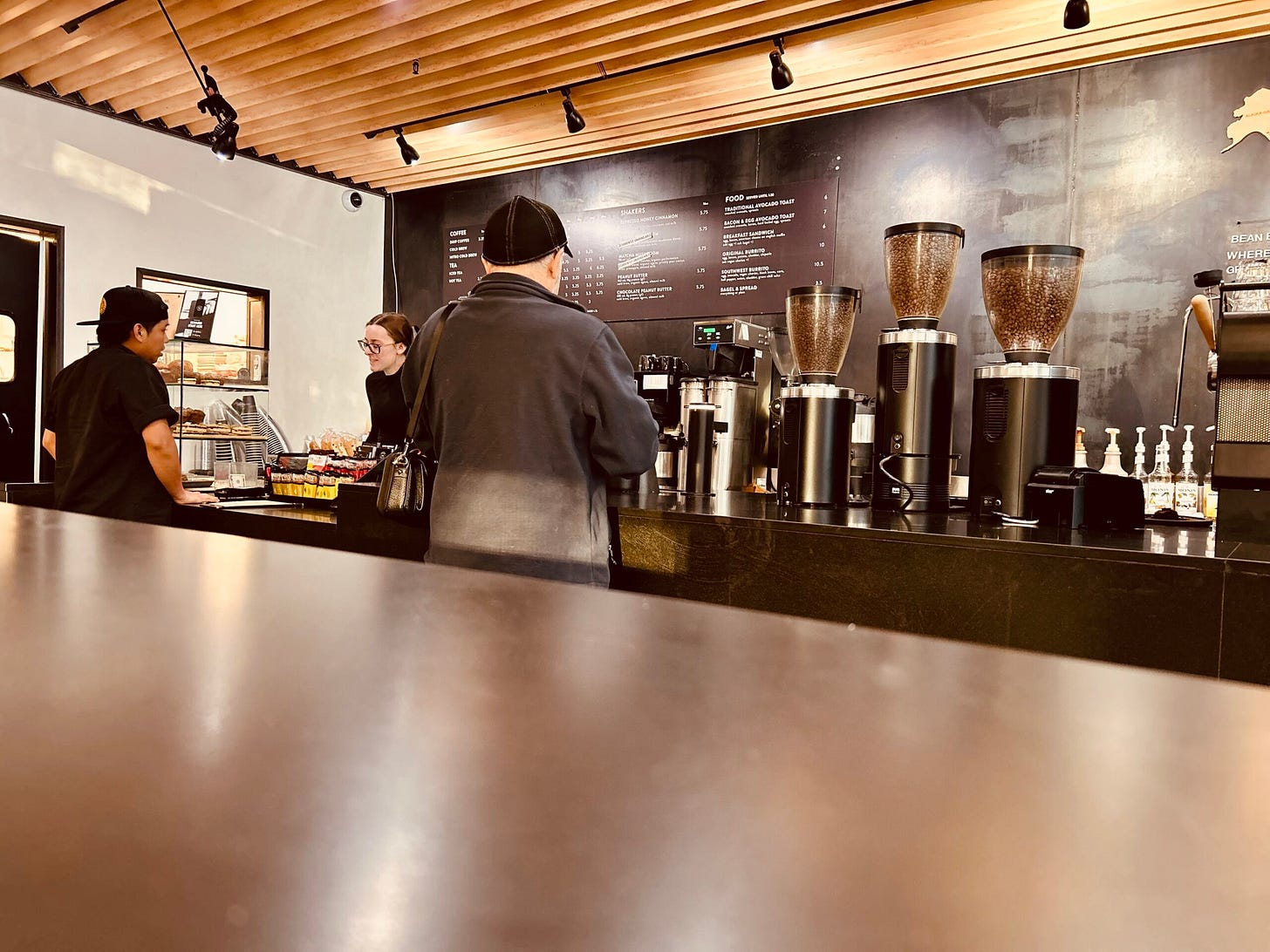 coffee shop, lights, menu, people