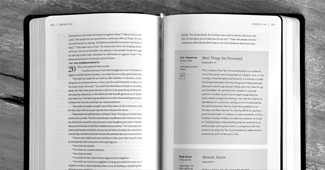 an open book sitting on top of a wooden table