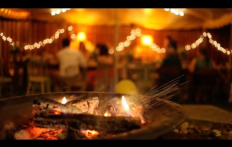 Three warm screenshots from our wedding video in our backyard.