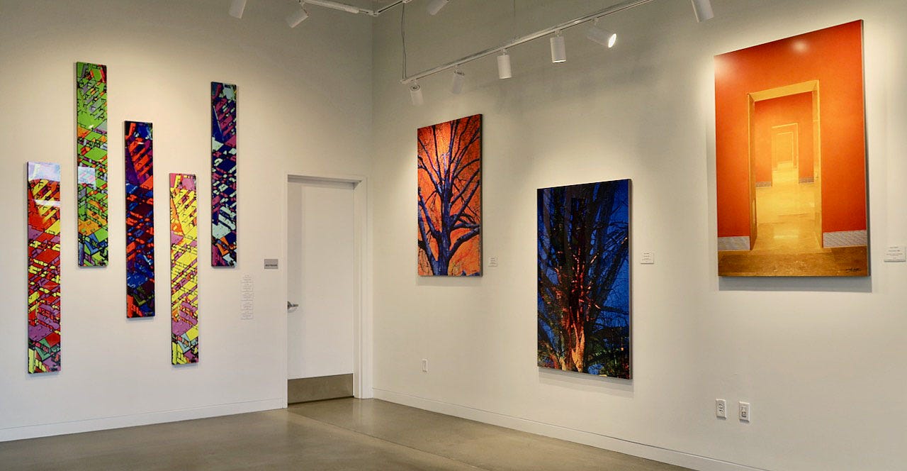 A room with art on the wall

Description automatically generated
