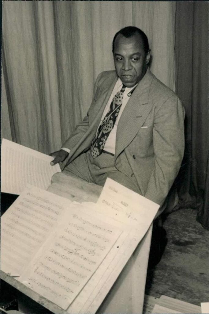 Don Redman with music scores.