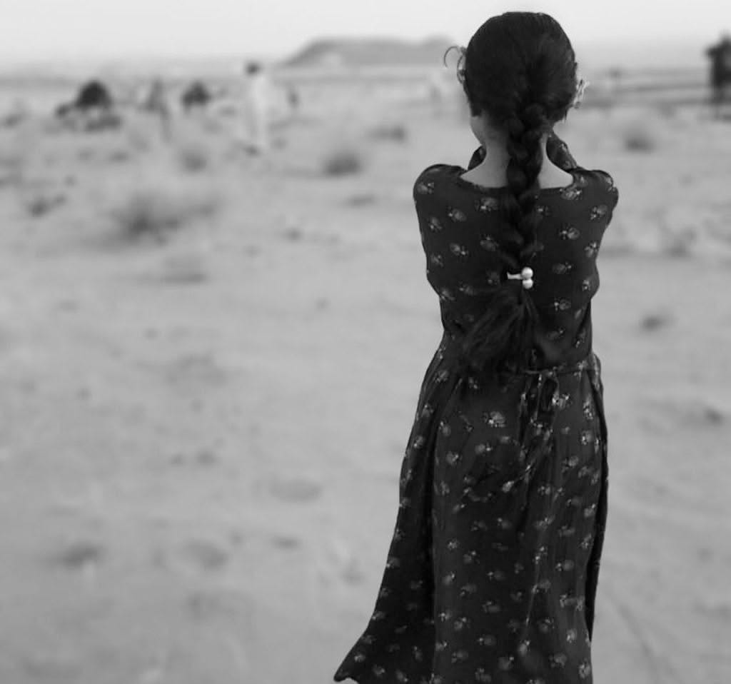 May be a black-and-white image of child