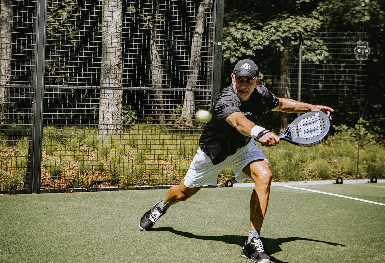 David Eisen playing padel on his home court in the Hamptons