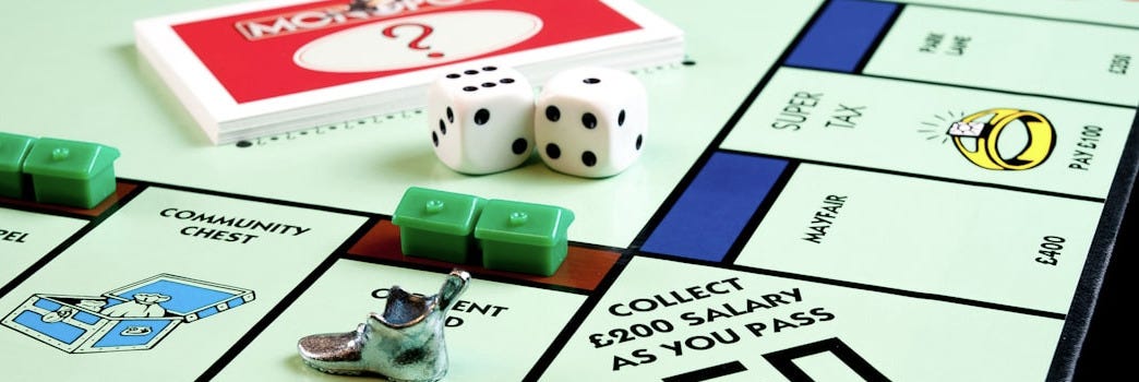 a close up of a monopoly board game a close up of a monopoly board game