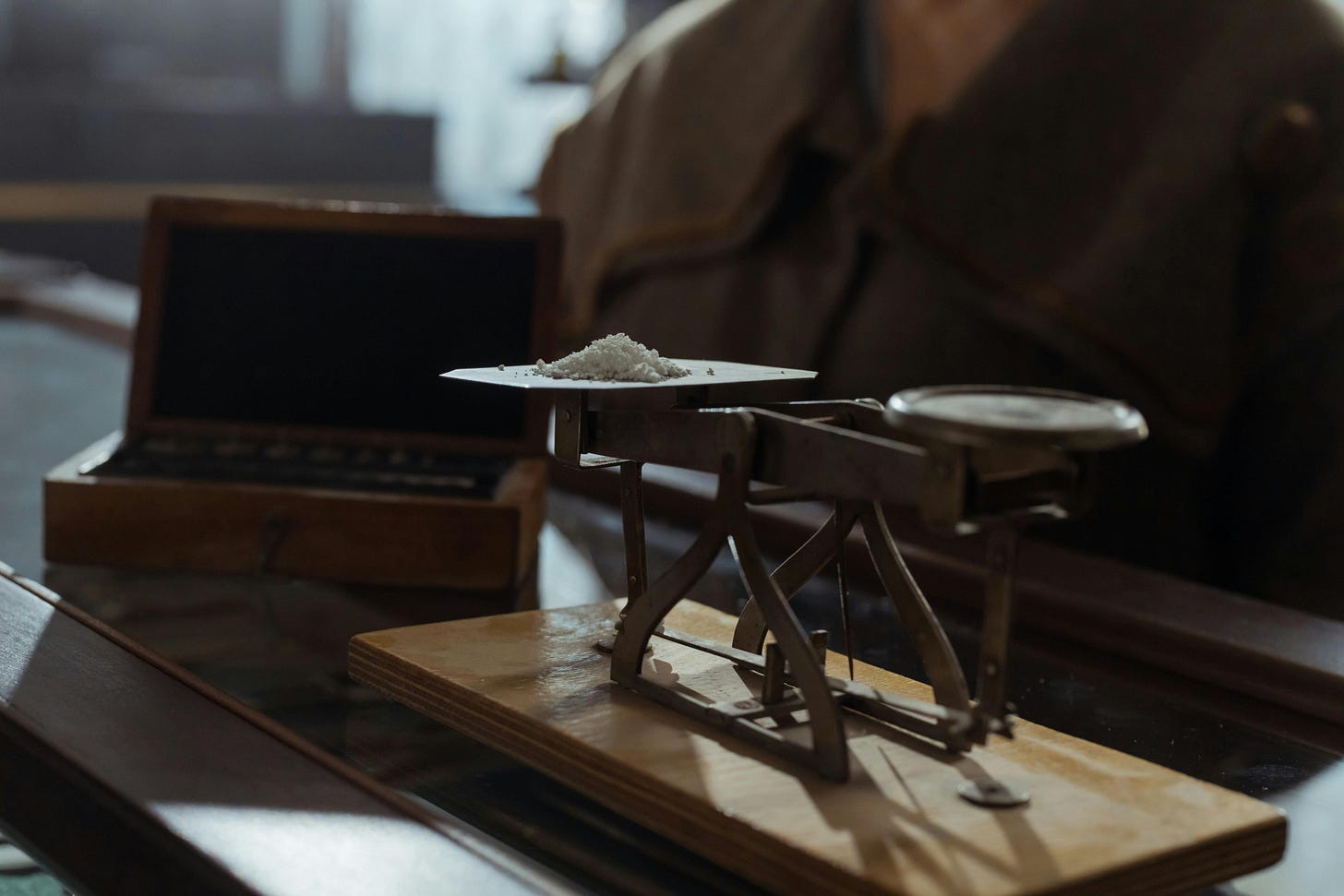 Powder being weighed on platform balance