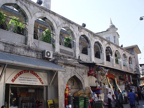 LEFT TO RIGHT: The Rüstem Pasha Mosque (foreground) is dwarfed by the much larger Süleymaniye Mosque; The two small entry doors behind a kebab stand; Shops beneath the mosque.