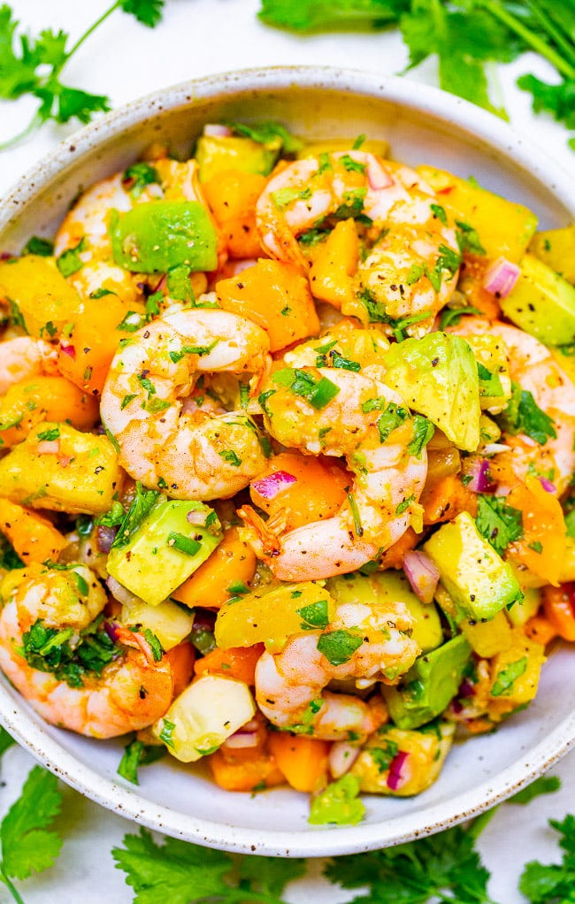 Avocado Mango Shrimp Salad — With tropical fruit, avocado, red onion, lime juice, cilantro, and plump JUICY shrimp, this EASY 15-minute recipe will become a new FAVORITE!! Healthy and light with an assortment of wonderful flavors in every bite!!