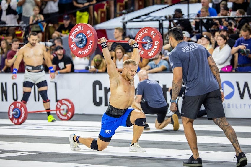 Jonne Koski at the 2023 CrossFit Games luning with a barbell overhead