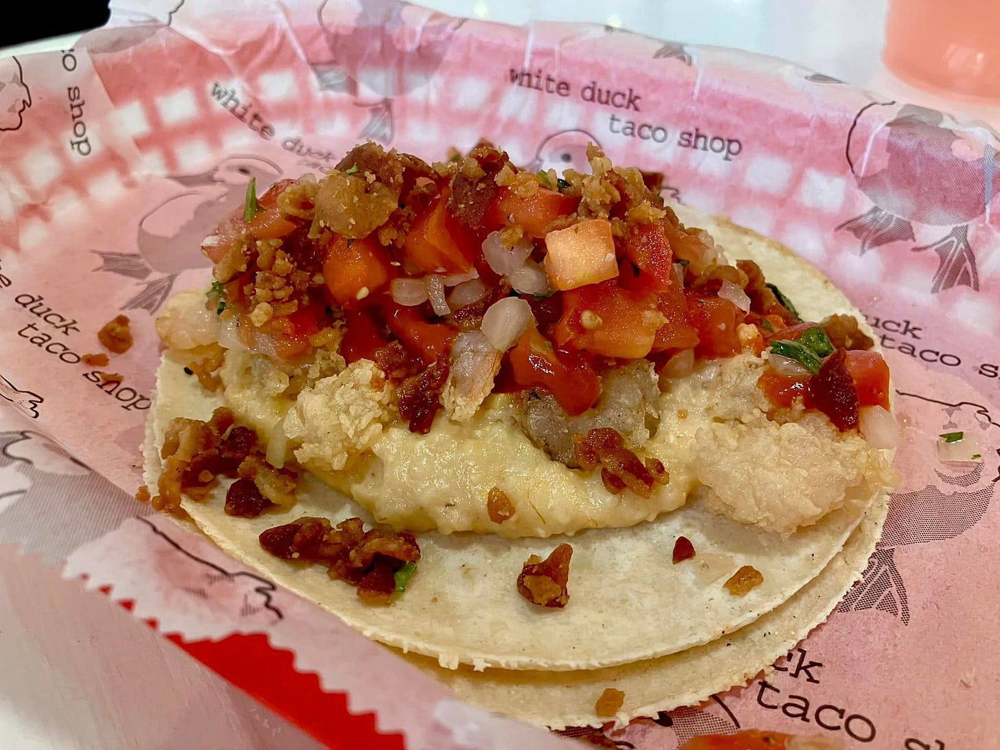 May be an image of burrito and taco