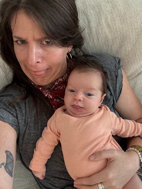 three photos of meg holding her 3-week old niece. meg attempts to mirror the same faces Charlie makes in every picture. they look alike - dark hair, light eyes.
