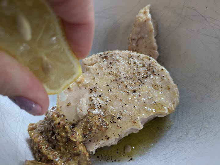 Mixing the tuna and spices, assembling the tuna on toast to melt cheese on top.