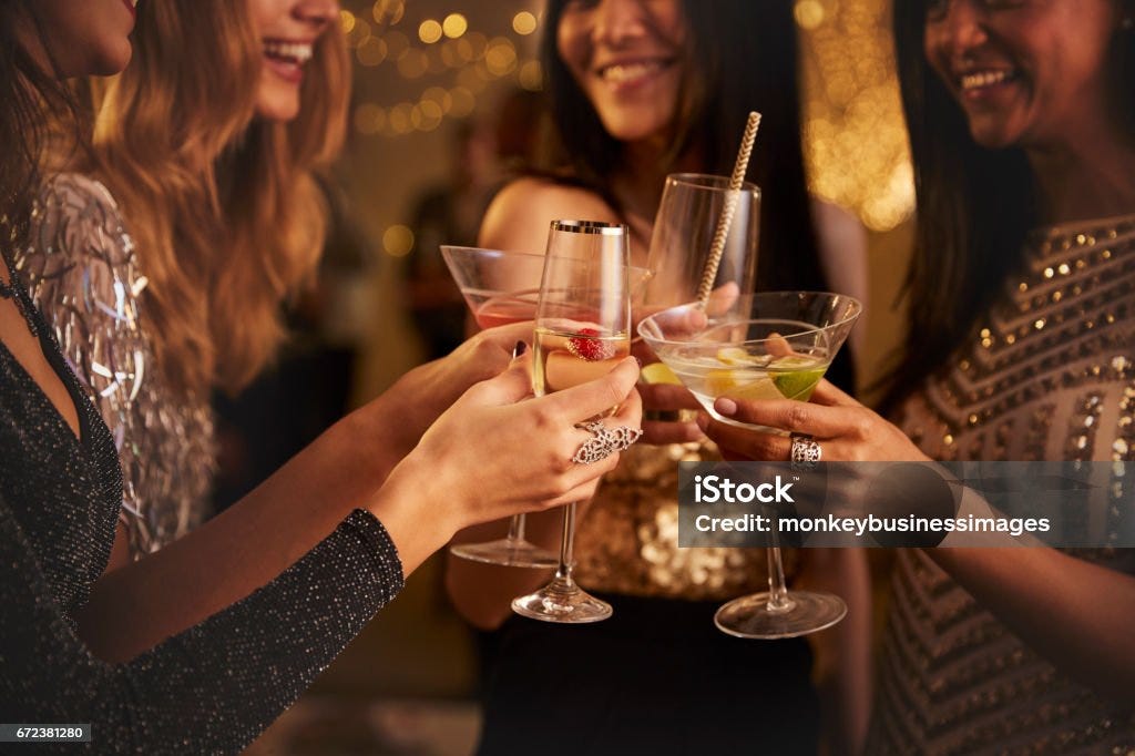 Female Friends Make Toast As They Celebrate At Party Women Stock Photo Female Friends Make Toast As They Celebrate At Party Women Stock Photo