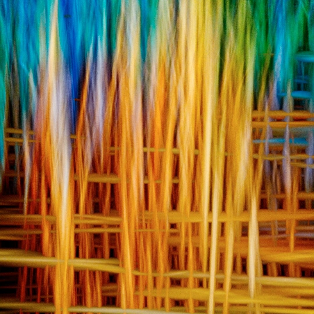 A bunch of colorful sticks that are stacked together A bunch of colorful sticks that are stacked together