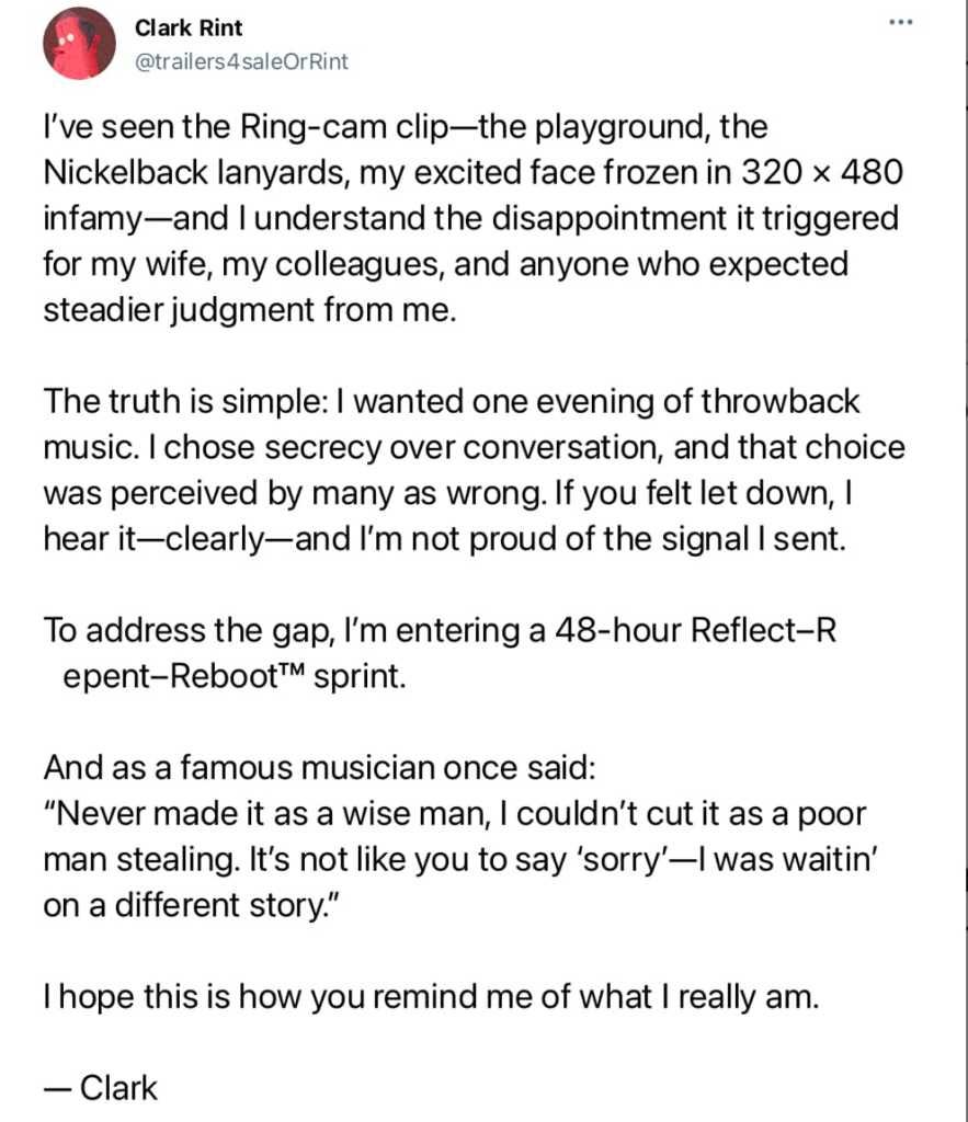 A silhouette of a man standing on a beach during sunset, with an orange sky and calm ocean waves in the background.