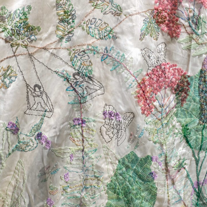 Diptych: pink and white flower petals lie on wrinkled white satin; Right: Double exposure of flowers embroidered on cream satin and the black stitched outline of a child swinging.